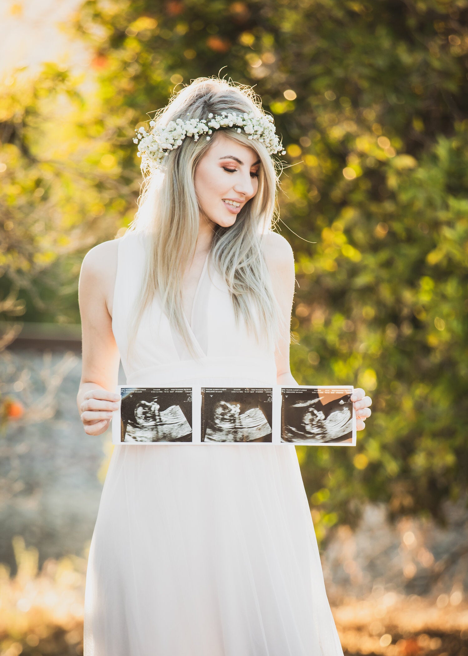 Pregnant woman holding 2D ultrasound made in Franklin, TN